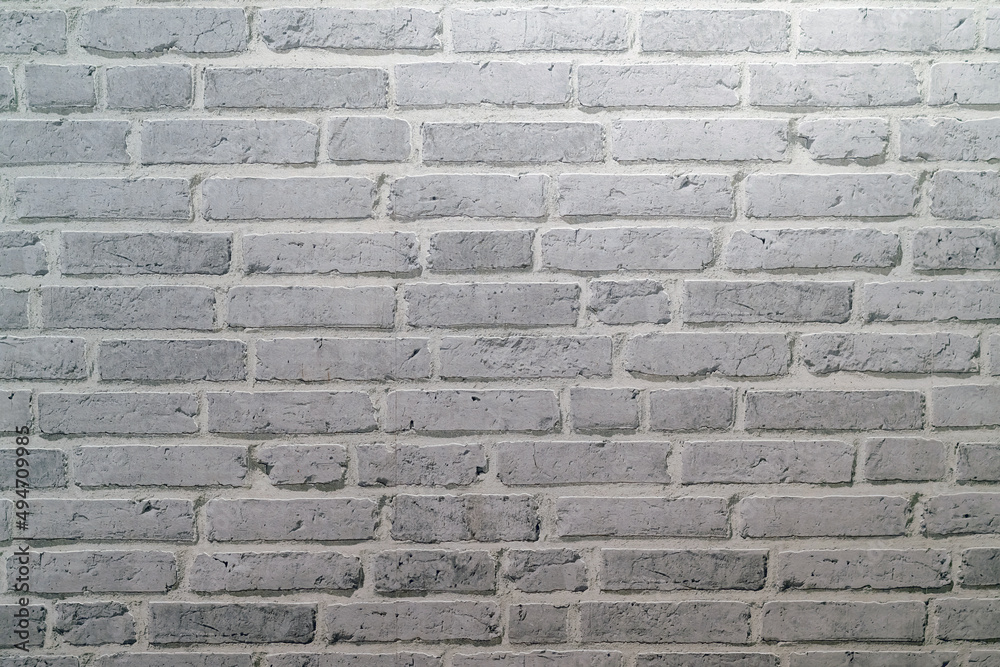 White brick wall texture background made by pattern paper. Wall texture background flooring rock stone old pattern clean concrete grid uneven bricks design stack. Background for the wall in LOFT style White brick wall texture background made by pattern paper. Wall texture background flooring rock stone old pattern clean concrete grid uneven bricks design stack. Background for the wall in LOFT style