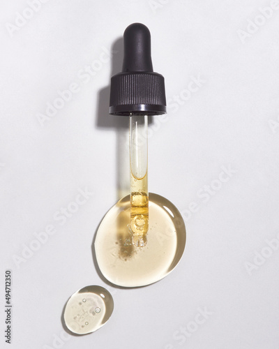 Wallpaper Mural Pipette with Hyaluronic acid on table Torontodigital.ca