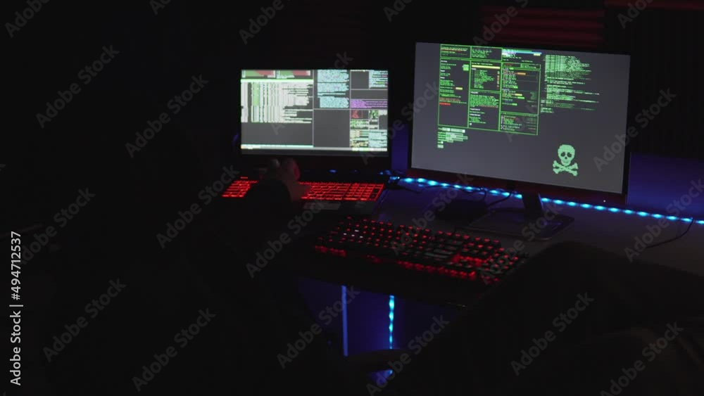 A relaxed hacker using his computer A relaxed hacker using his computer