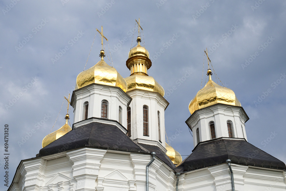 Gilded domes of an ancient Orthodox church against the sky. Catherine's Church
