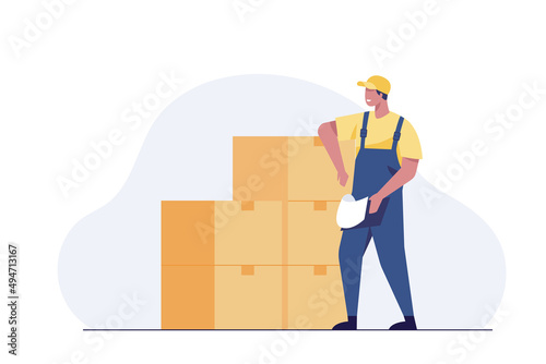 warehouse worker checking boxes in warehouse.