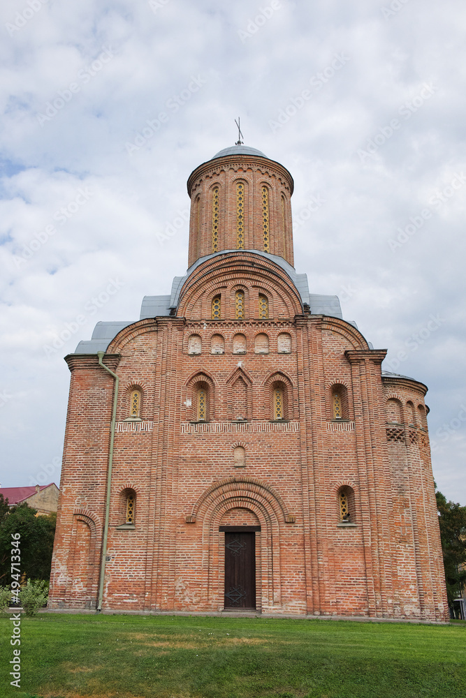 Medieval brick church in the Ukrainian city of Chernihiv. Medieval architecture. Church on a cloudy day. Friday Church in Chernihiv.