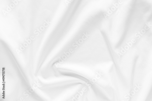 White fabric texture background. Cloth soft wave. Creases of satin, silk, and cotton.