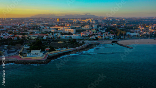wide view of Santo amaro of Oeiras from sky over ocean