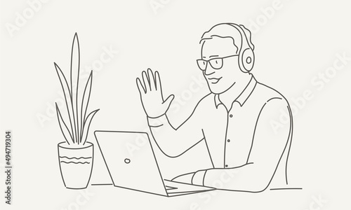 Smiling consultant with headset and computer talking with customer. Video conference meeting.