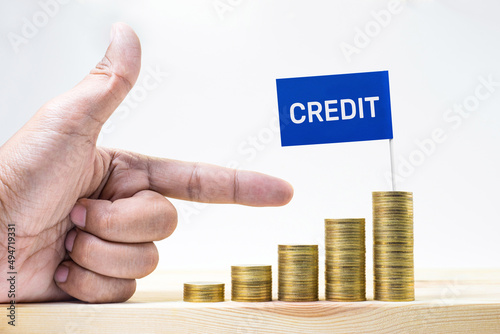 Credit text with coin glowing up.financial and banking