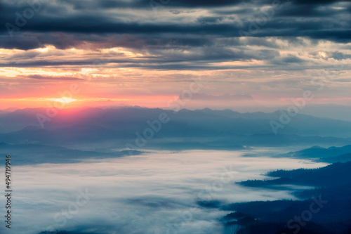 Beautiful sunrise over mountain with Doi Luang Chiang Dao peak and foggy in the valley at national park © Mumemories