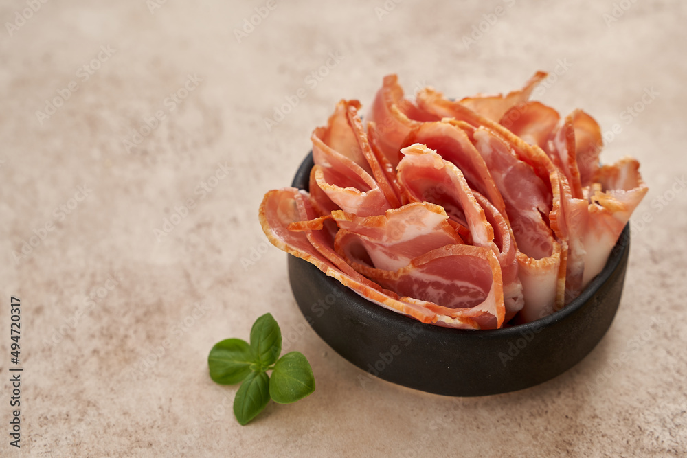 bacon - ingredients for carbonara pasta on a beige background bacon - ingredients for carbonara pasta on a beige background