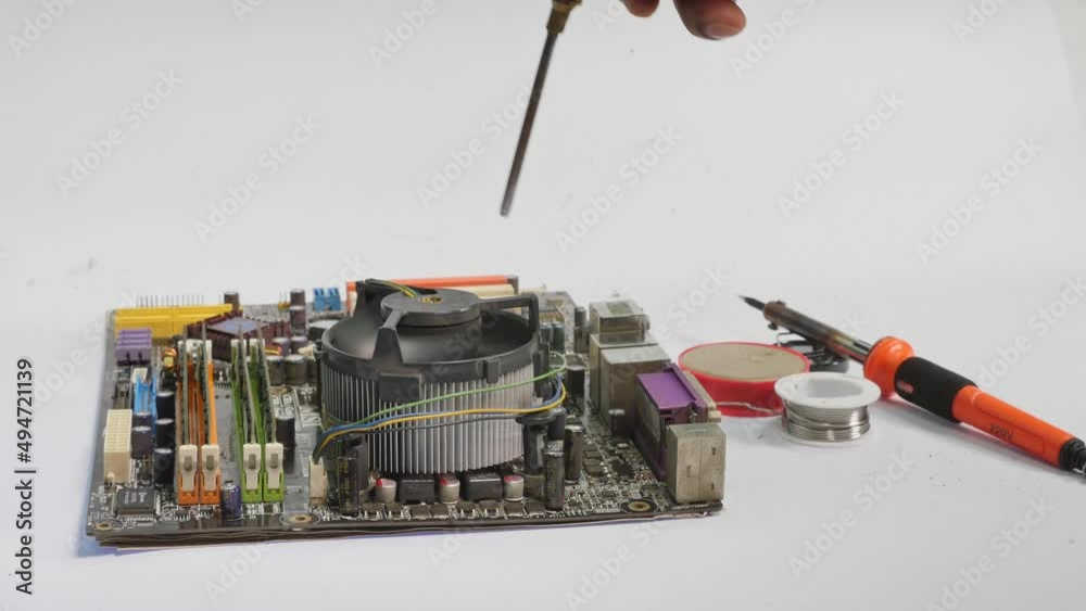 cleaning computer motherboard..using air compressor cleaning the computer mainboard on black