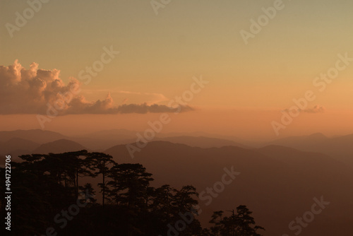 sunset with mountains in the background