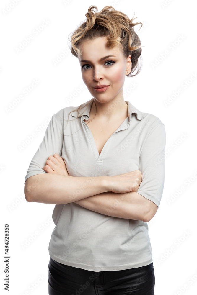 A beautiful woman stands with crossed arms. Smiling blonde in a gray tank top. Confidence and success. Isolated on white background. Vertical. A beautiful woman stands with crossed arms. Smiling blonde in a gray tank top. Confidence and success. Isolated on white background. Vertical.