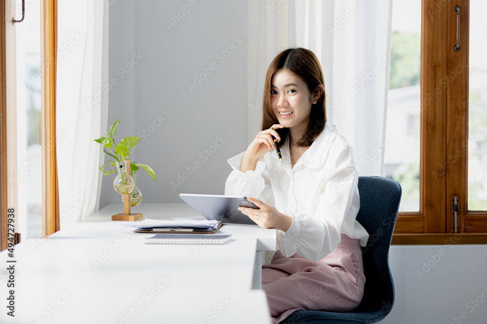 Beautiful Asian woman is a businesswoman who leads a new generation of startups, a woman who runs and manages a business plan to build confidence and stability in business, woman-led business concept. Beautiful Asian woman is a businesswoman who leads a new generation of startups, a woman who runs and manages a business plan to build confidence and stability in business, woman-led business concept.