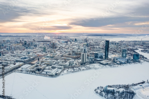 Yekaterinburg aerial panoramic view in Winter at sunset. Yekaterinburg city and pond in winter.