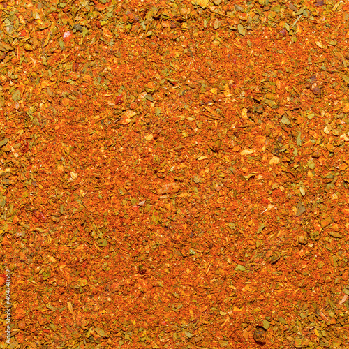 Photo of closeup texture of orange spice for meat and chicken and other food, background