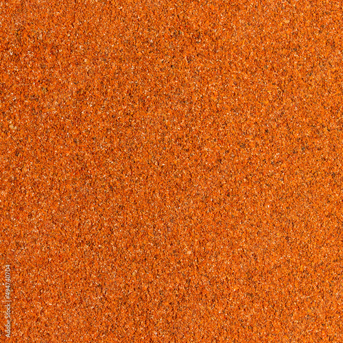 Photo of closeup texture of hot spice of red pepper for different food, background