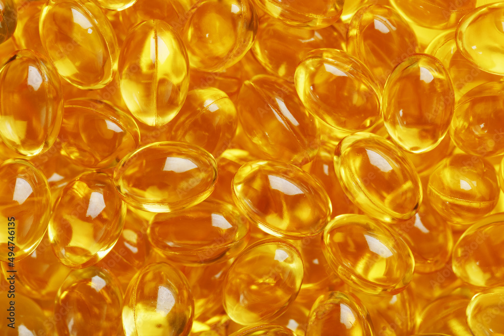 Background of capsules in a shell with vitamin Omega 3 Fish oil