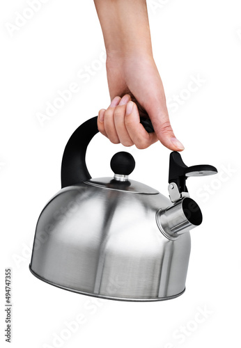 female hand holding a metal teapot with a whistle on a white background photo