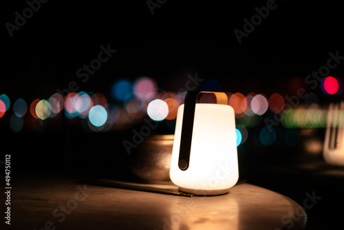 illuminated candle bulb with silky blurred background at night