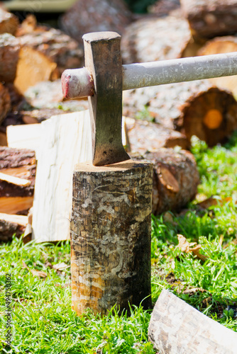 an ax on a wooden log.