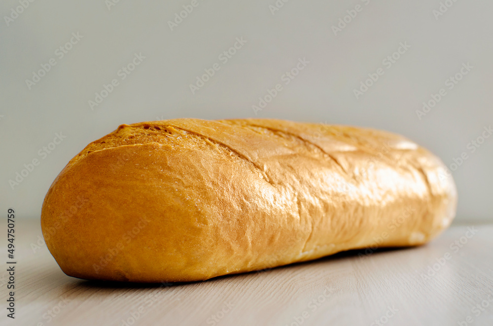 a loaf of wheat flour lies on the table.
