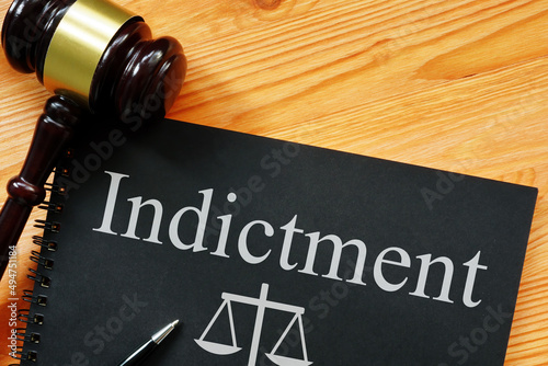 Indictment is shown on the photo using the text photo