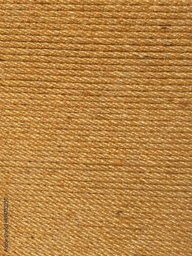 rope twine straw entwined yellow background