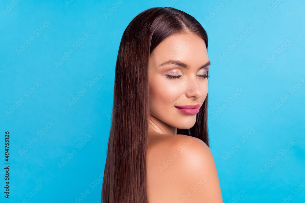 Profile side photo of charming positive lady with closed eyes show glowing makeup isolated on blue color background Profile side photo of charming positive lady with closed eyes show glowing makeup isolated on blue color background