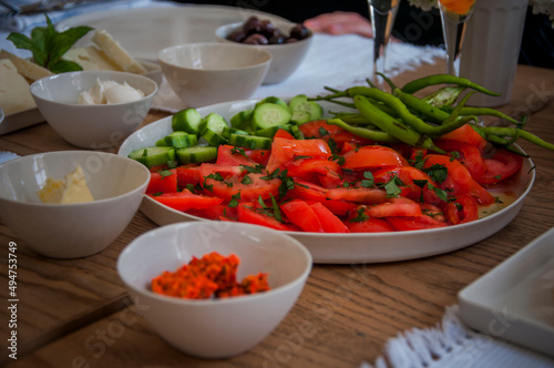 Mediterranean breakfast with fresh colorful vegetables on wooden table  front view