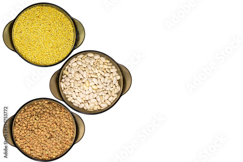 three glass bowls with grains of various cereals isolated on white background