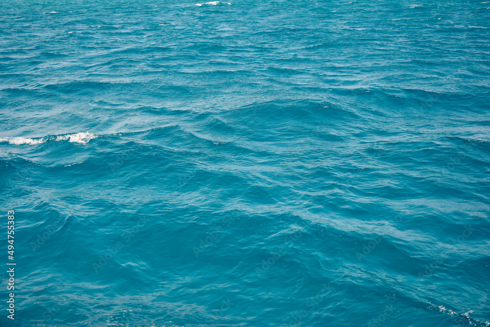 Abstract natural background, surface, texture. Waves of blue sea water. Copy space. Selective focus. Abstract natural background, surface, texture. Waves of blue sea water. Copy space. Selective focus.