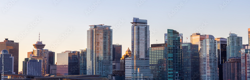 Panoramic View of Modern City Building Skyline. Sunny Winter Sunrise. Coal Harbour, Downtown Vancouver, British Columbia, Canada. Cityscape Panorama Background