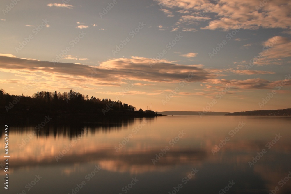 reflection of clouds and trees in the water - Lysaker