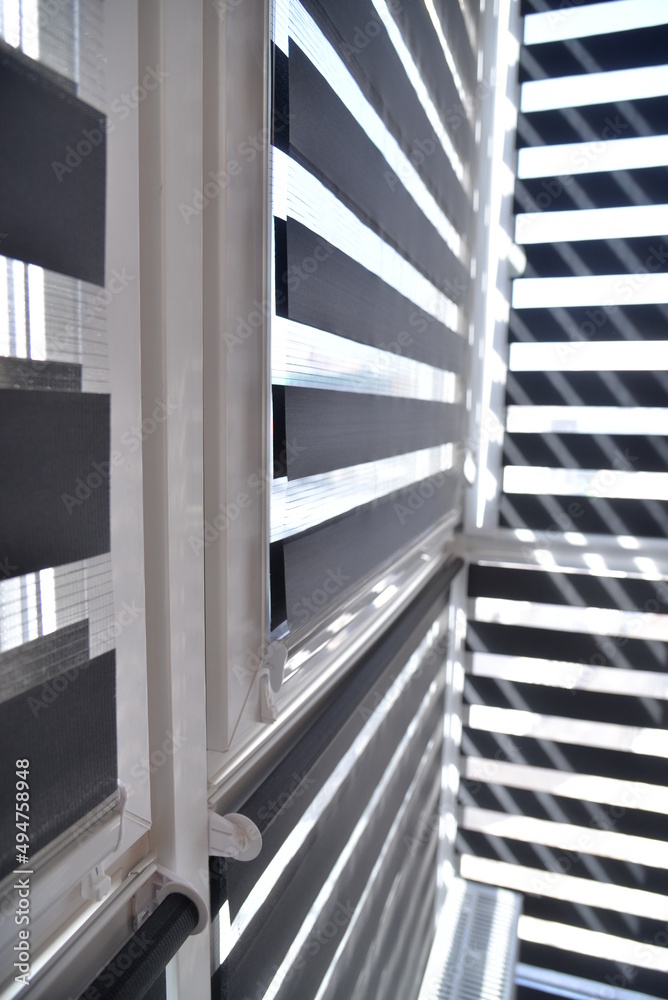 Obraz premium sunlight breaks through the blinds