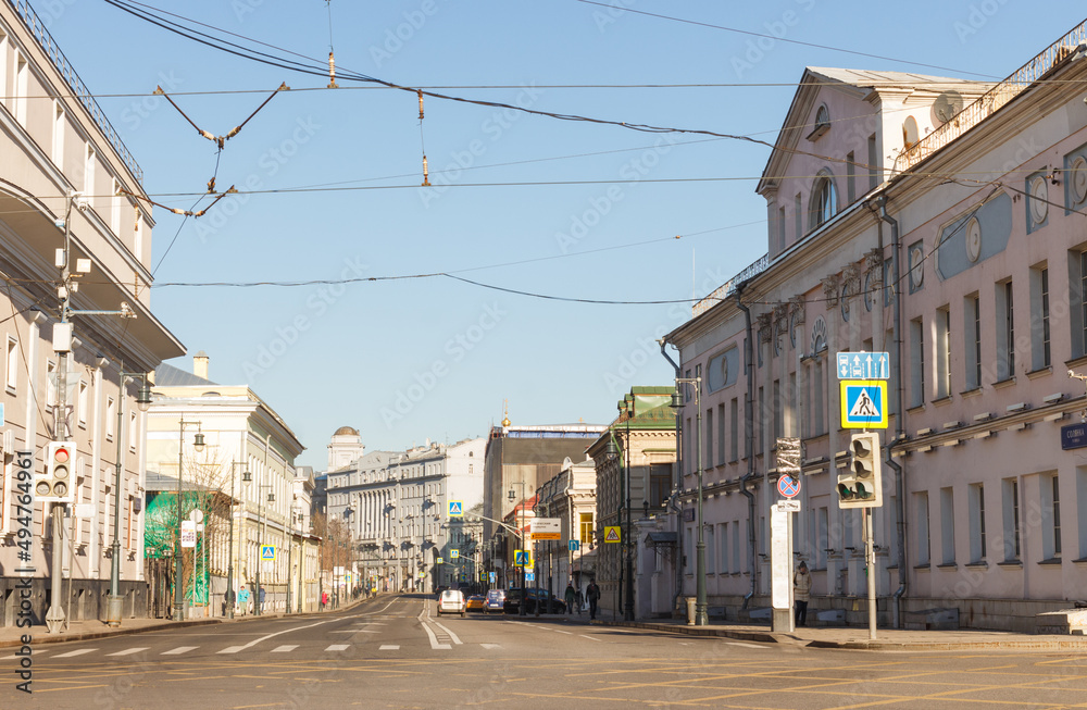 Moscow, Russia, Mar 2, 2022: Morning view  of Solyanka street. Bright sunny day and deep shadows. No snow