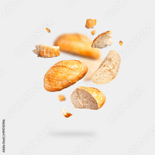 Tela Classic white wheat bread flying on gray background