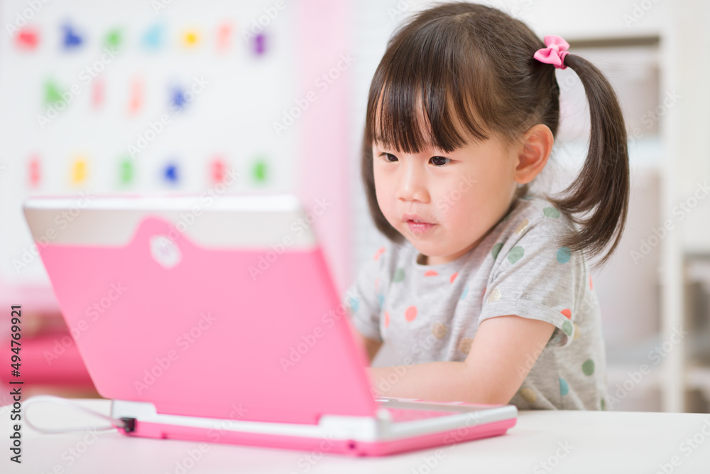 young girl using laptop for online learning during lockdown time young girl using laptop for online learning during lockdown time
