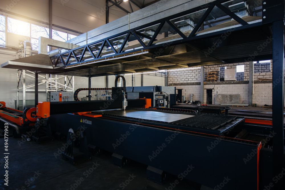 Naklejka premium Working CNC laser cutting machine