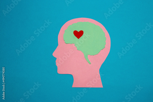 pink pink head blue brain and in it a little red heart, love that is deep in our head, waiting to be awake,creative design about human emotions