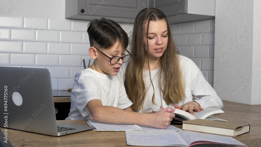 A boy and his older sister are learning lessons. Study A boy and his older sister are learning lessons. Study