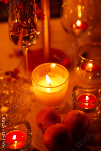 romantic evening with candles  champagne and tangerines