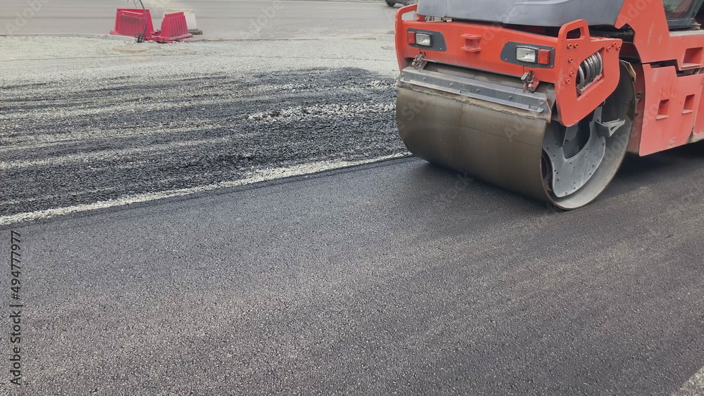 Asphalt Rool Work Repair new road asphalting roller. Applying hot resin sidewalk ...