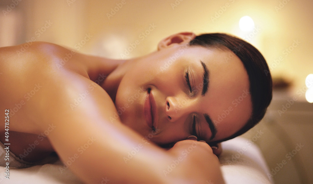 I could lie down on here for eternity. Shot of a beautiful young woman relaxing during a spa treatment. I could lie down on here for eternity. Shot of a beautiful young woman relaxing during a spa treatment.