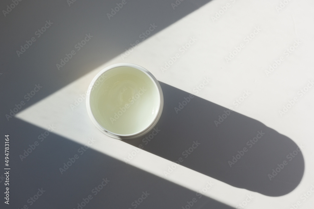 Closeup of a tub of petroleum jelly.