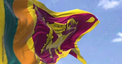 Detail of the national flag of Sri Lanka waving in the wind on a clear day photo