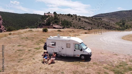 Tourists toasting at their Motorhome (Camper Van) in Albarracin, Teruel, Spain photo