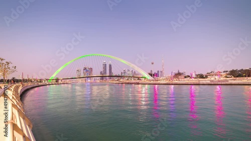 dubai canal walk sunset sky pedestrian crossing bridge downtown panorama 4k time lapse uae photo