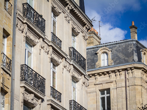Typical Haussmann style facades, from the 19th century, traditional in the city centers of French cities such as Paris, Bordeaux and Lyon, with their traditional stone facades and windows... #494791997