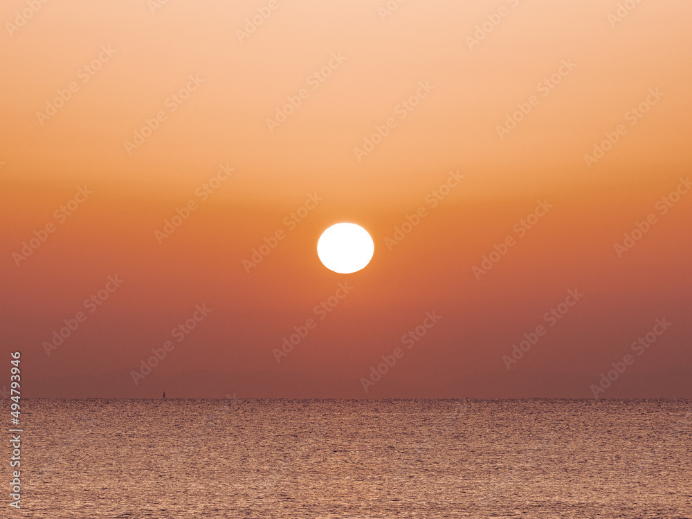Sunrise on the beach with calm sea