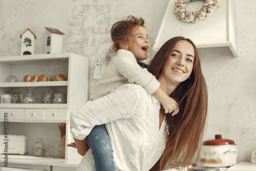 People spend time at home in a kitchen