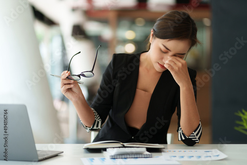 Asian business woman worry about marketing plan of this years.